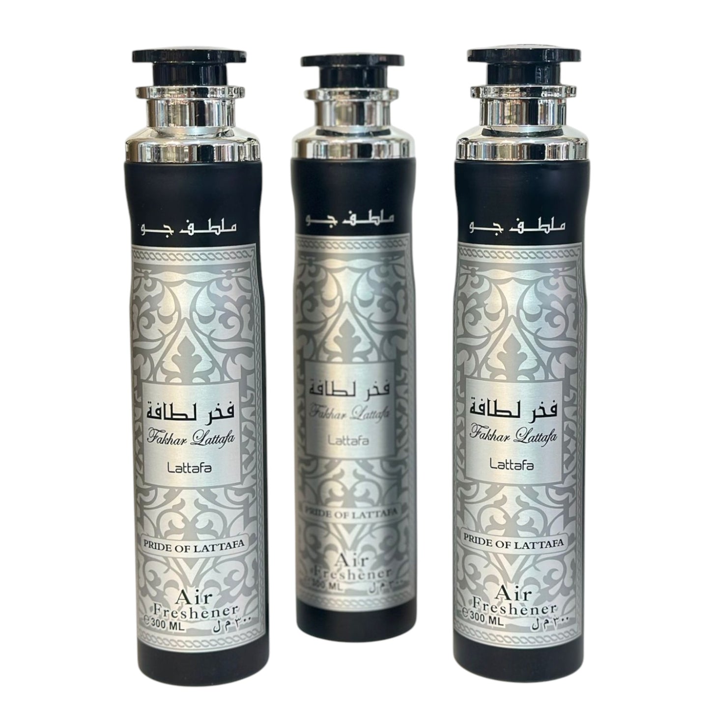 Three bottles of Fakhar air freshener with intricate silver patterns on the labels.