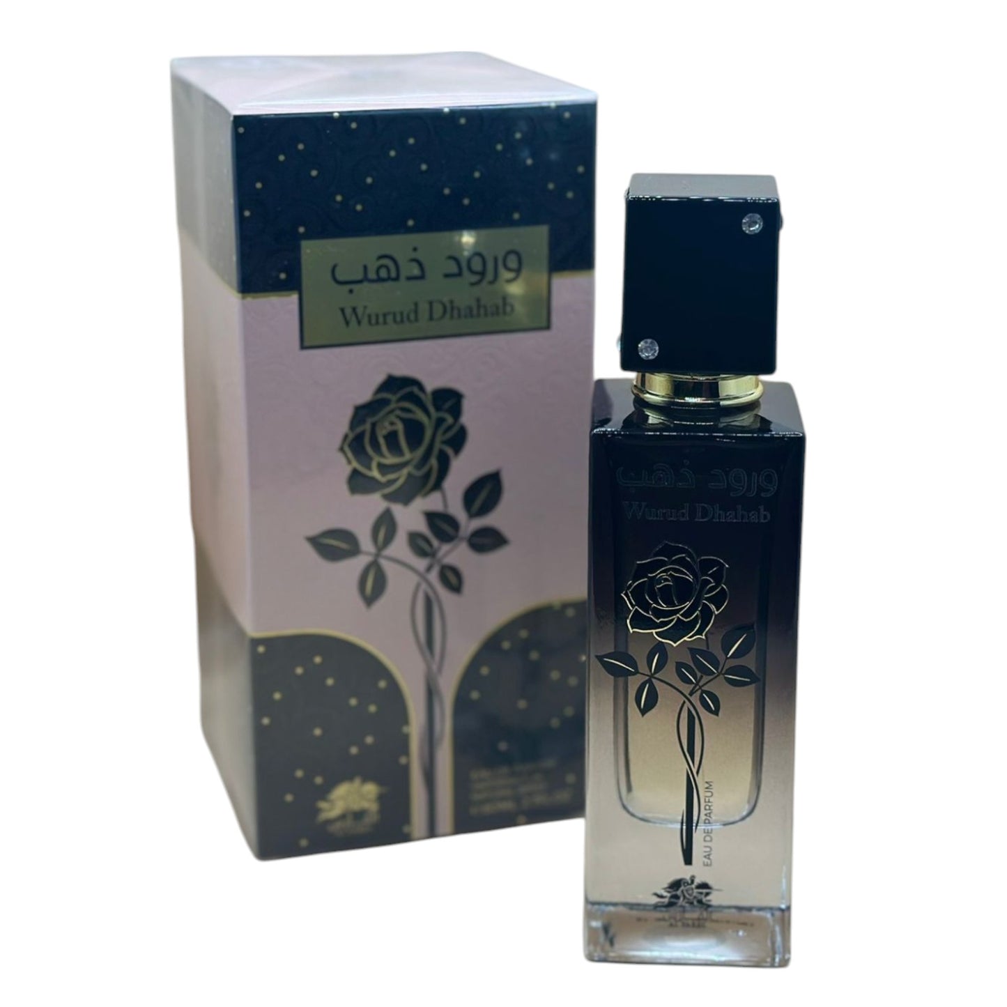 This image features the Wurud Dhahab Perfume, an Eau De Parfum available in a 100ml bottle. The product is displayed alongside its packaging, which is elegantly designed with a dark, moody background and gold accents that complement the luxurious feel of the perfume.