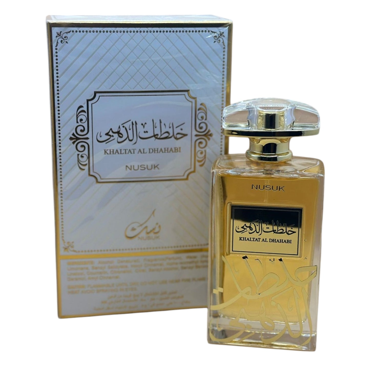 A perfume bottle with a gold label and a clear cap, displayed next to its box packaging which has Arabic script.