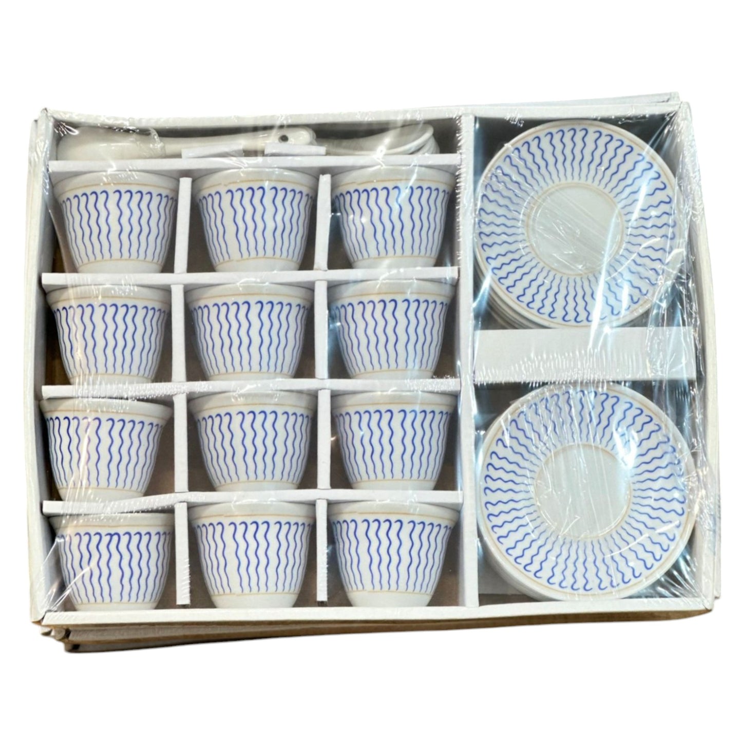 A set of Eritrean and Ethiopian ceramic coffee cups with saucers and spoons, packaged in a box, featuring a blue and white pattern.