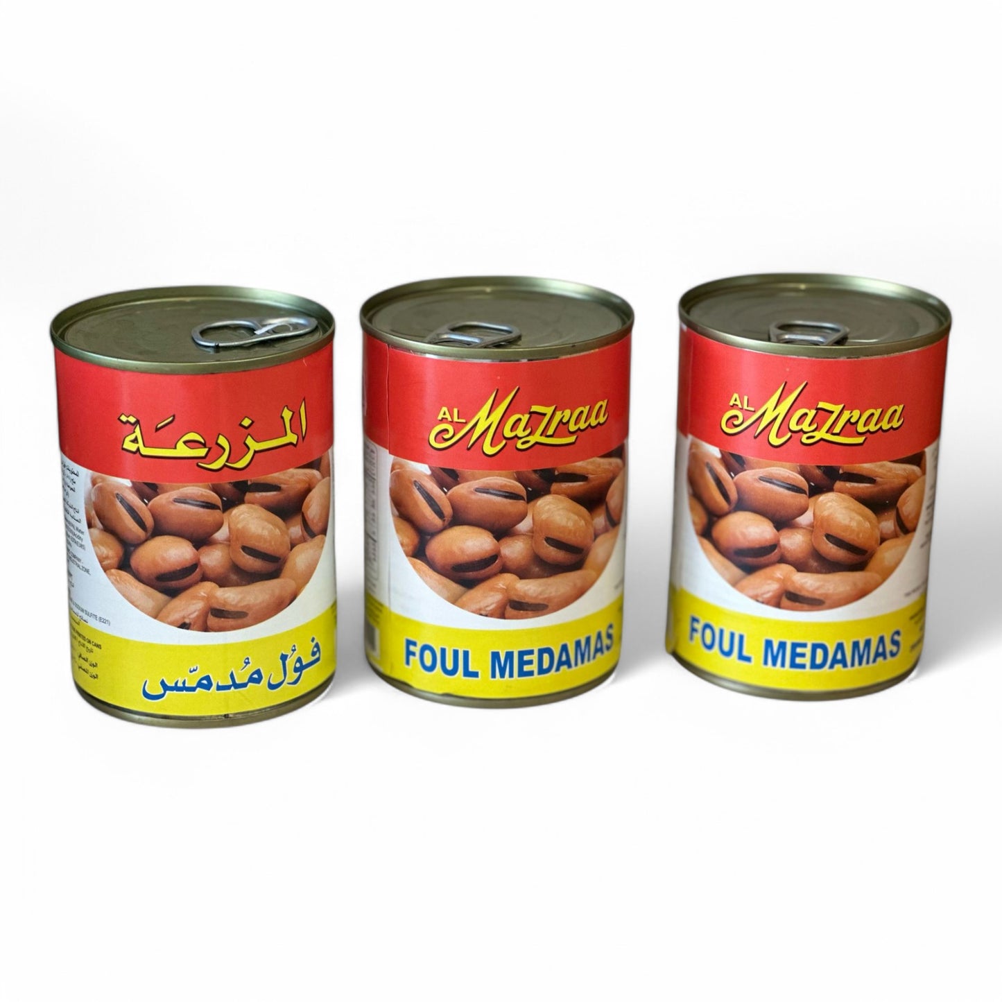Three cans of Al Mazraa Foul Medamas with the product visible through the transparent windows on the cans.