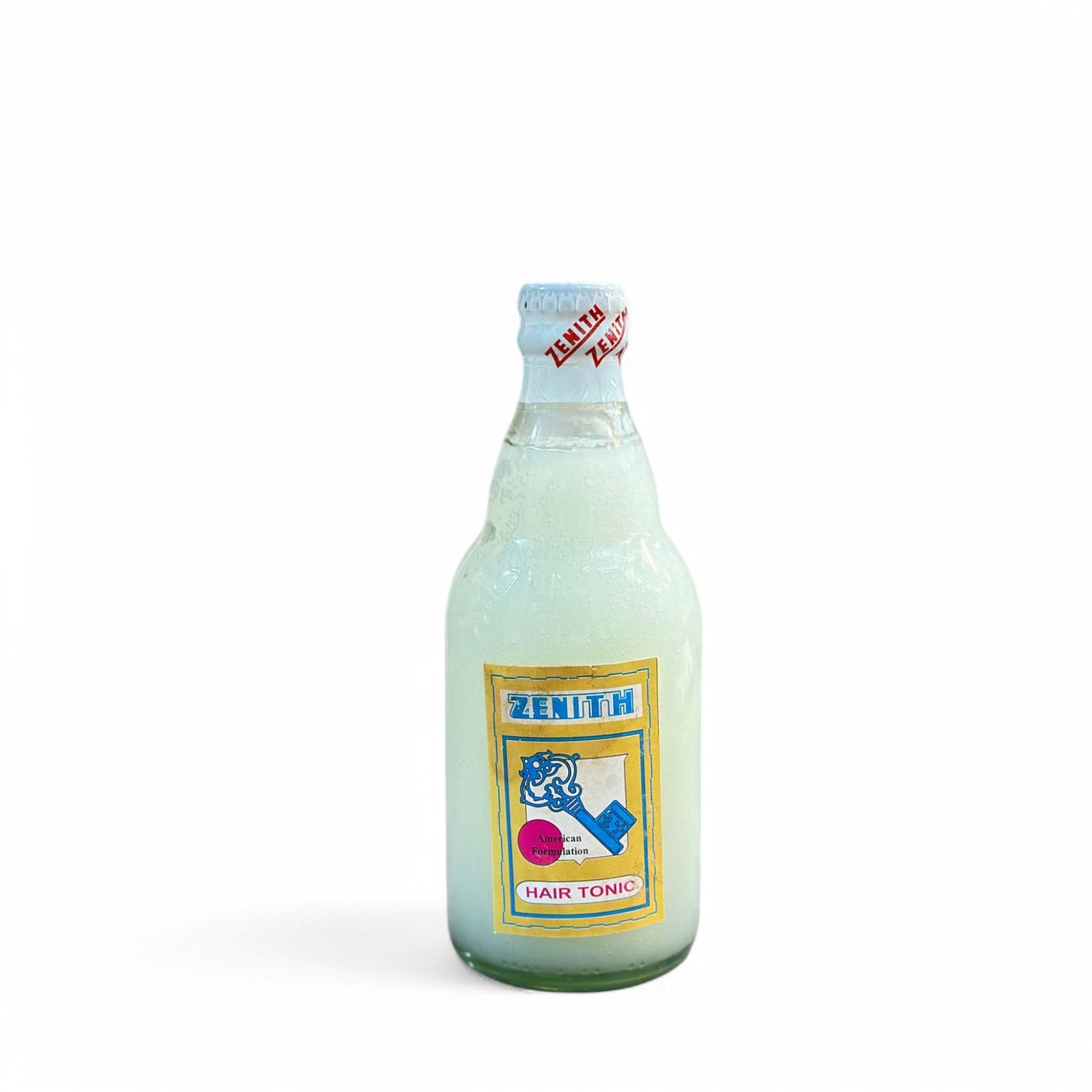 A bottle of Zenith Oliva Hair Oil with a label that includes the brand name and 'Hair Tonic' text, against a white background.