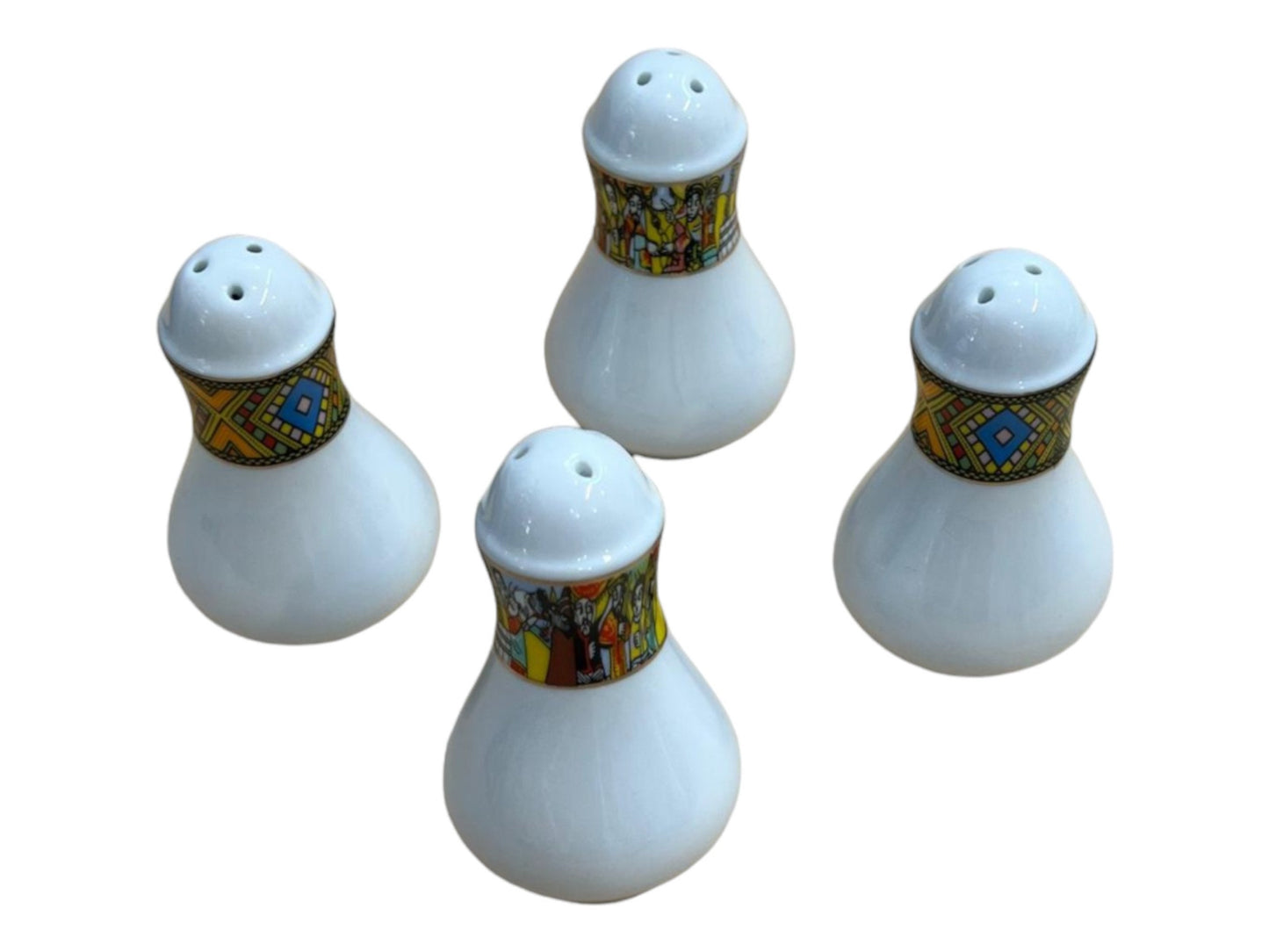 A set of four white salt holders with multicolored floral and geometric patterns on the base.