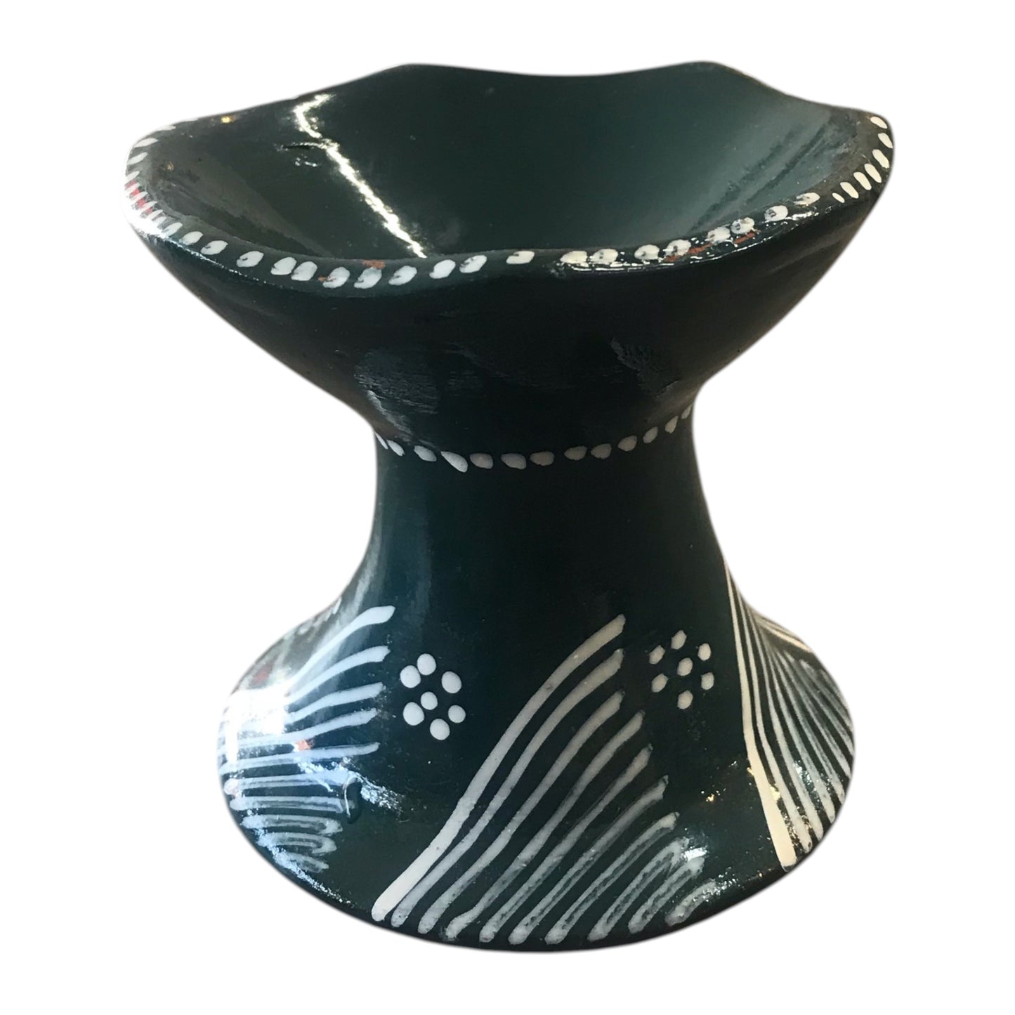 Black ceramic bowl with white patterns on a white background