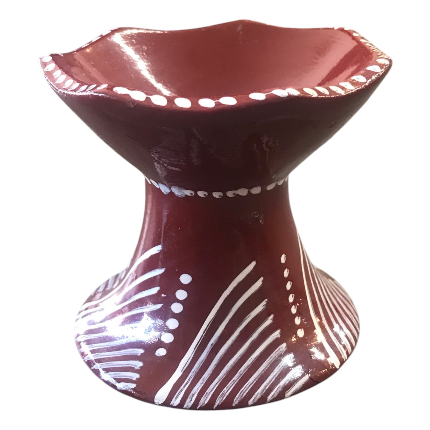 Ceramic bowl with white patterns on a white background