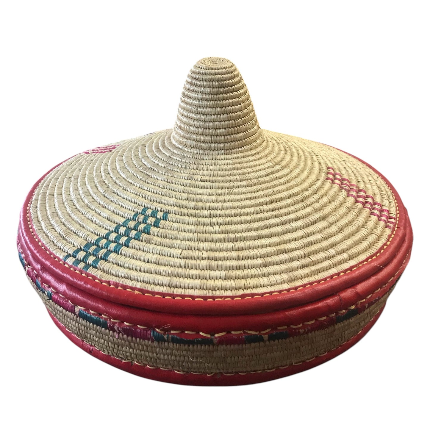 Woven basket with a red base and colorful patterns on a white background