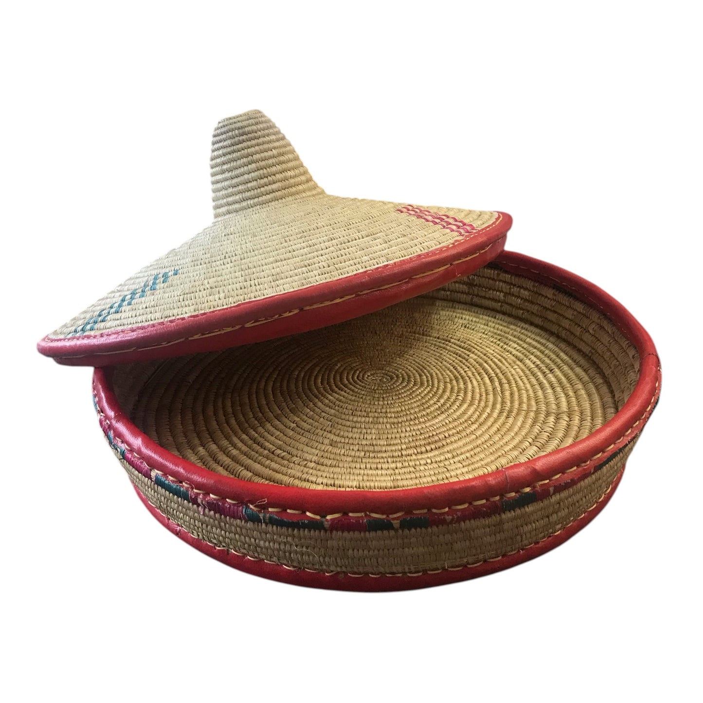 Woven basket with a lid on a white background