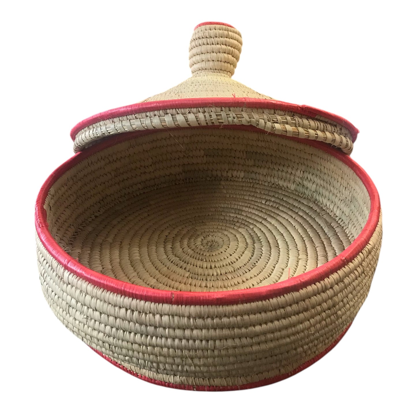 Woven basket with a red rim and lid on a white background
