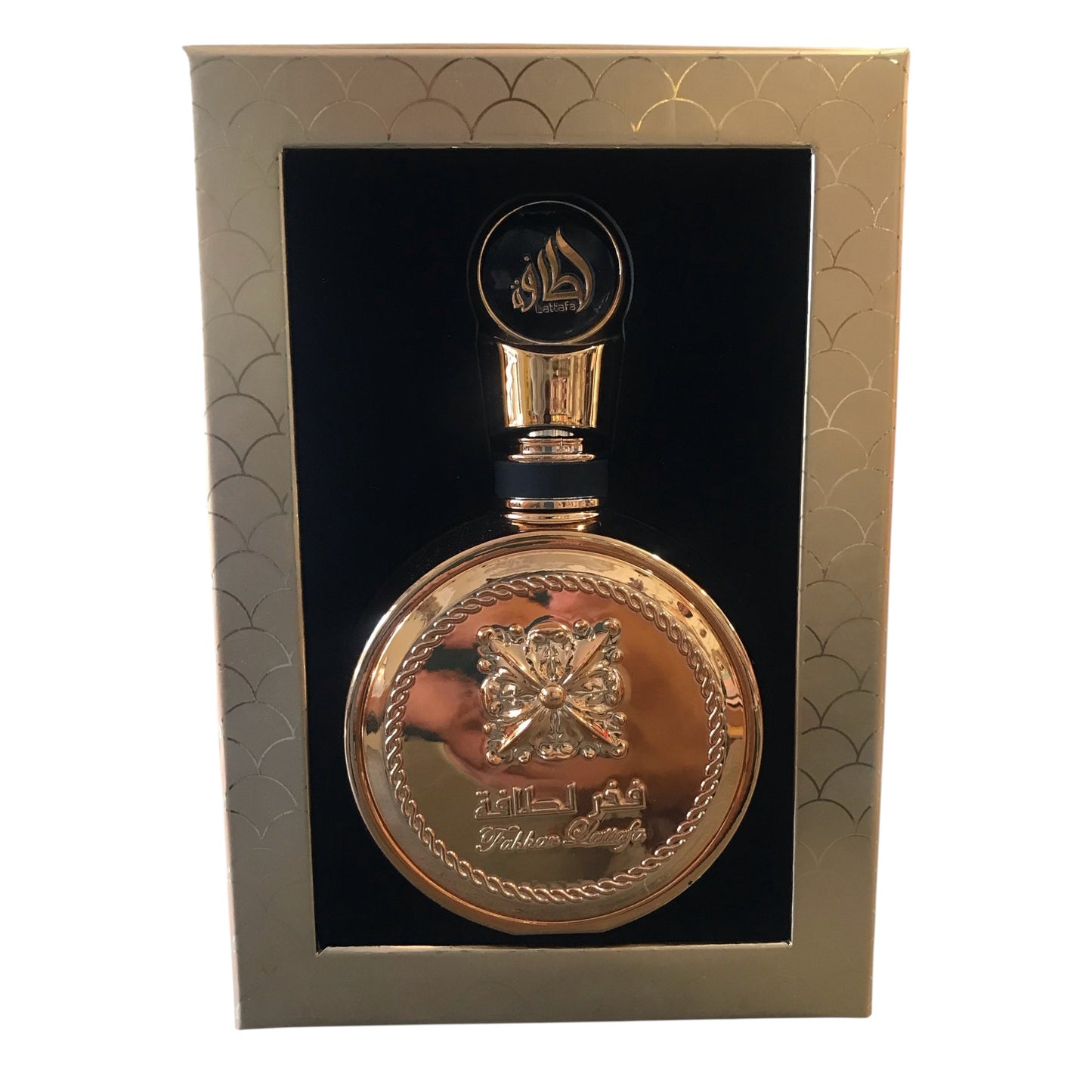 Gold decorative bottle with intricate design in a gold box