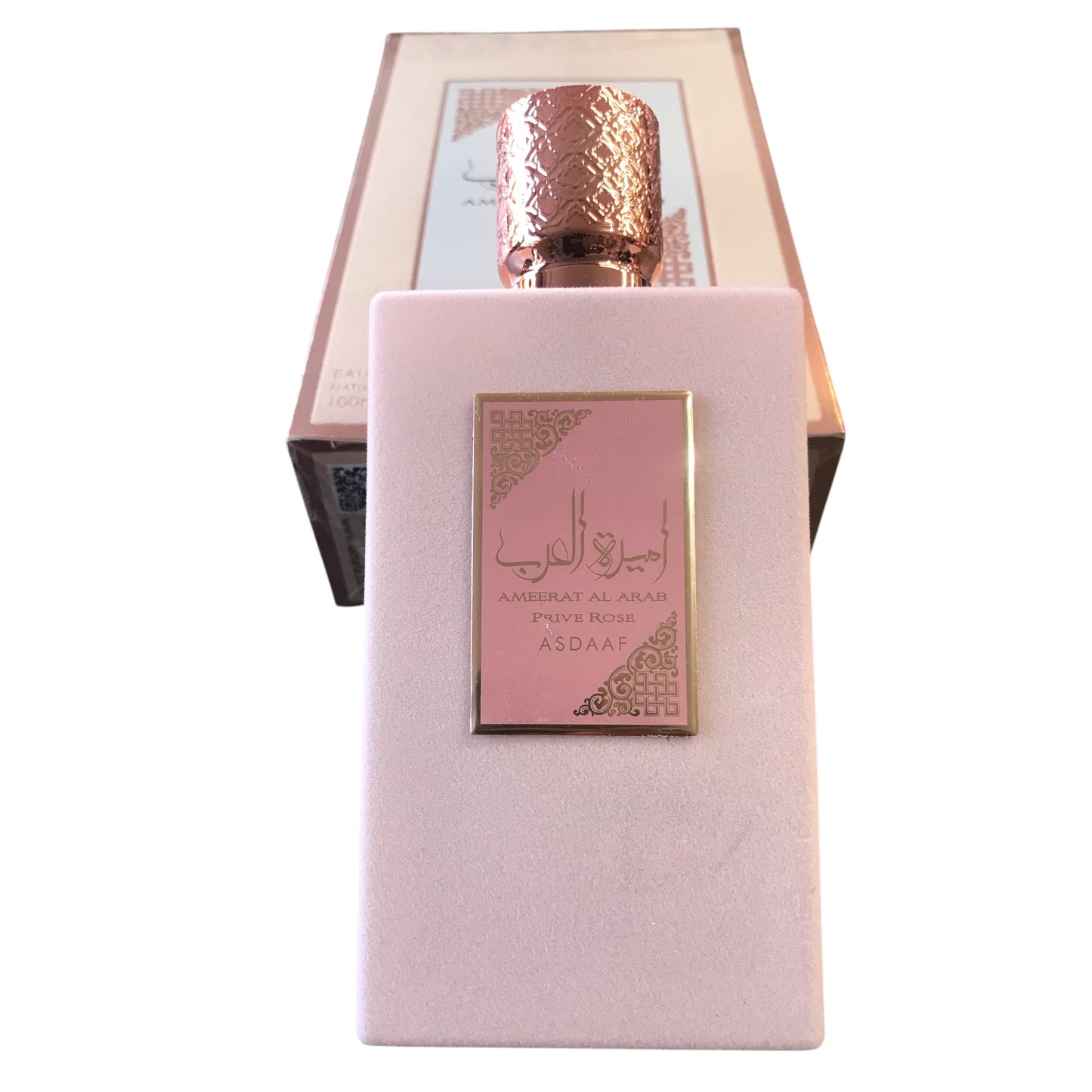 Perfume bottle with pink packaging and gold cap on a white background