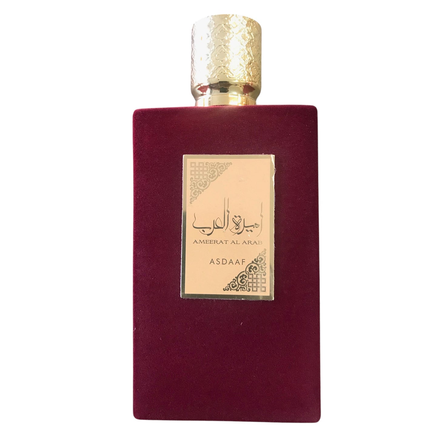 Maroon perfume bottle with gold cap and label on a white background