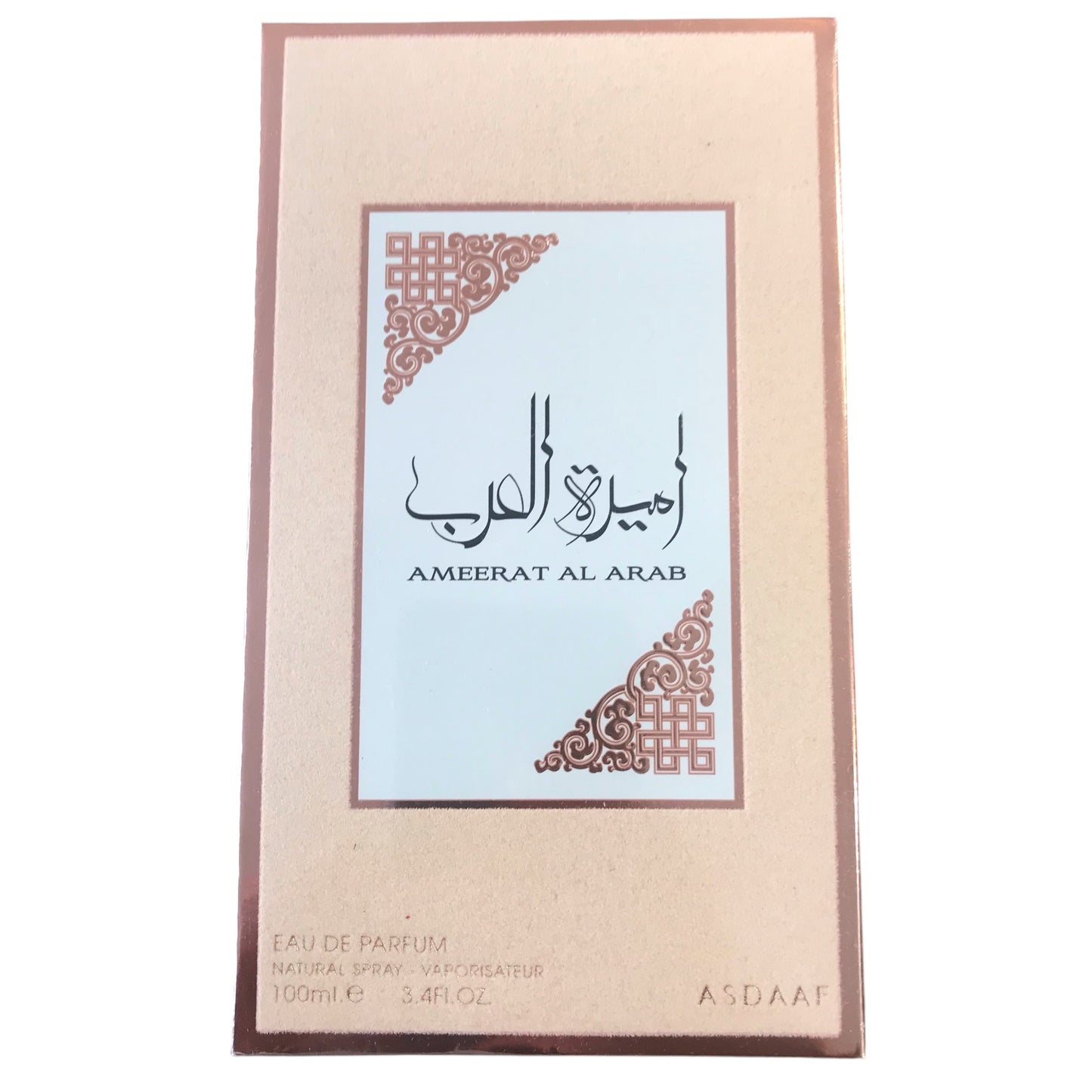 Perfume bottle packaging with decorative design and text on a beige background