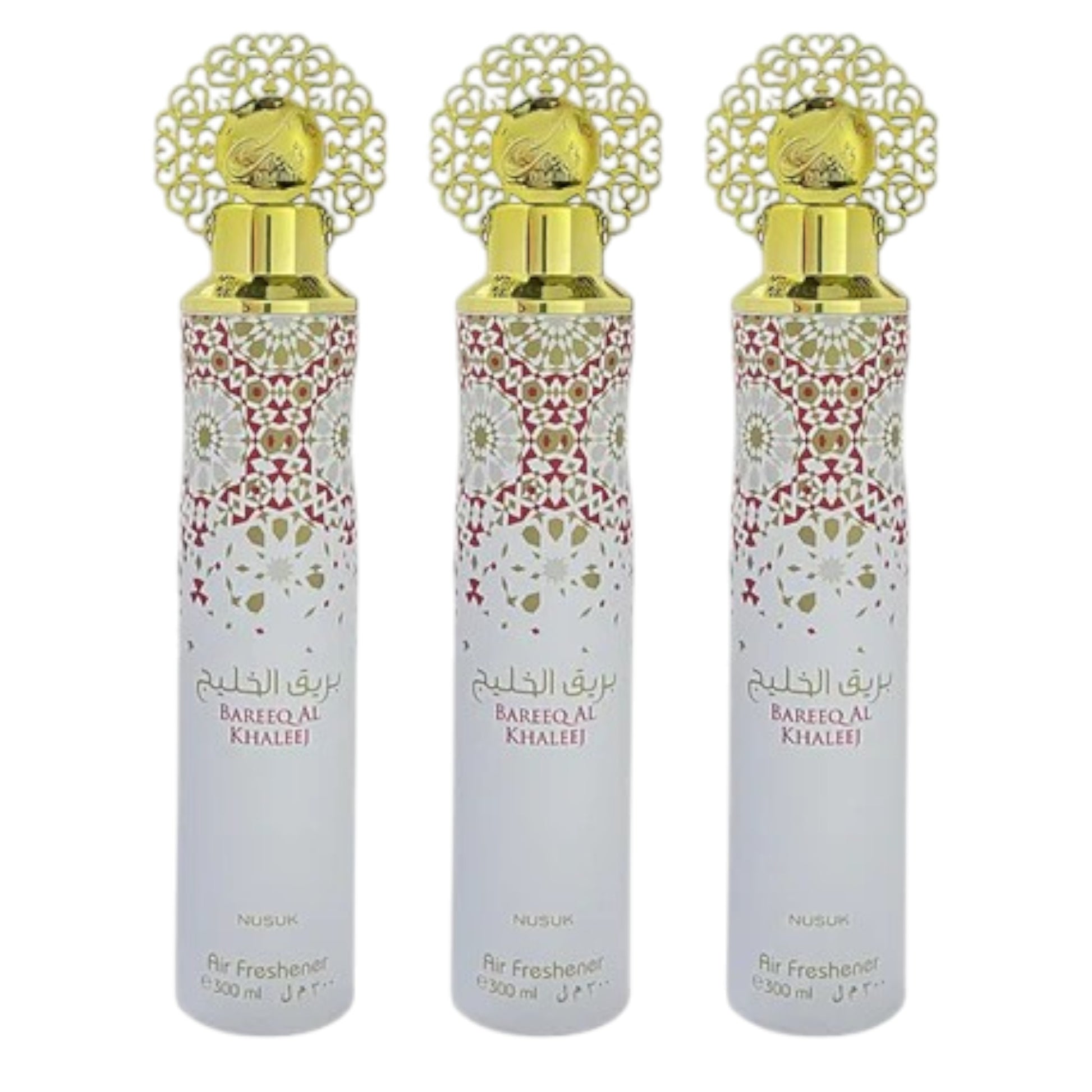 Three bottles of Bareeq Al Khaleej air freshener with decorative caps and floral patterns on the labels.