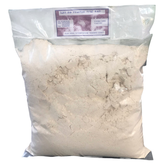 A sealed package of beige-colored flour, with a label that includes text and branding.