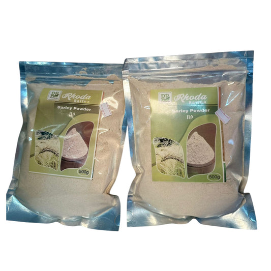 Two sealed packages of Rhoda barley powder, each marked with the brand name and the product name, displayed against a white background.