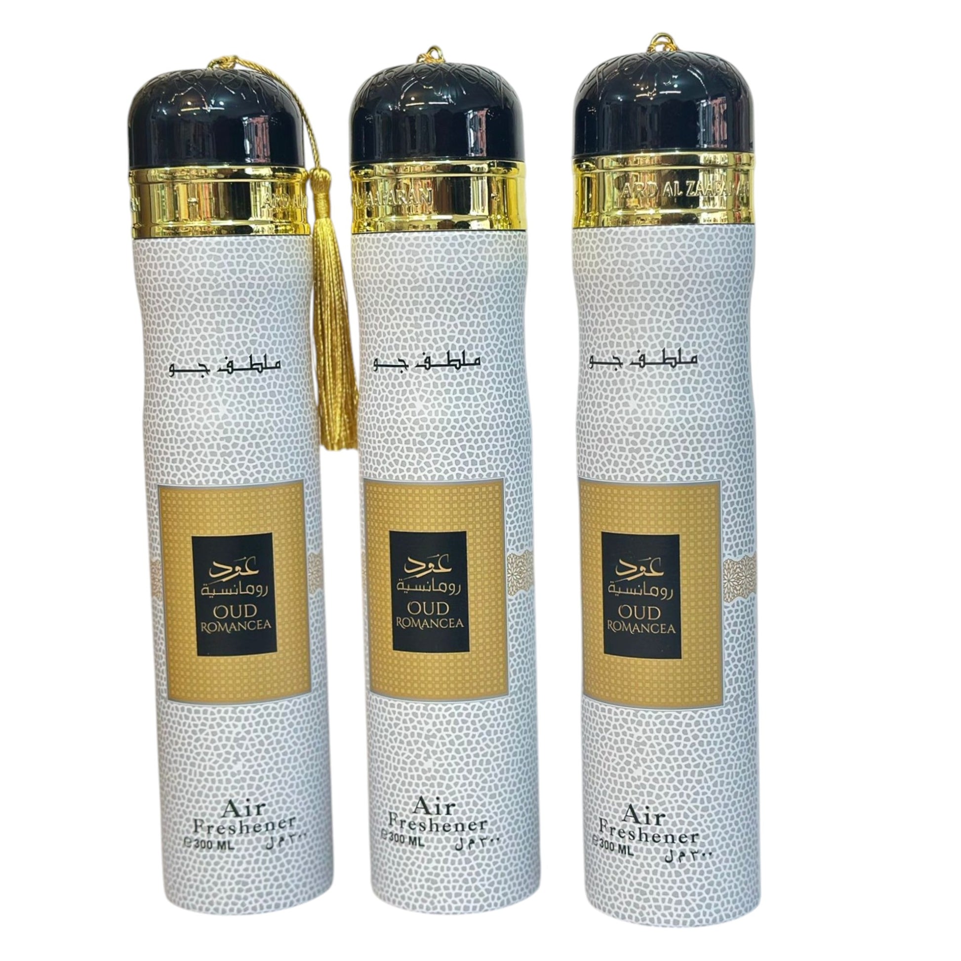 Three bottles of Oud Romancea air freshener with gold and black caps, arranged side by side against a white background.