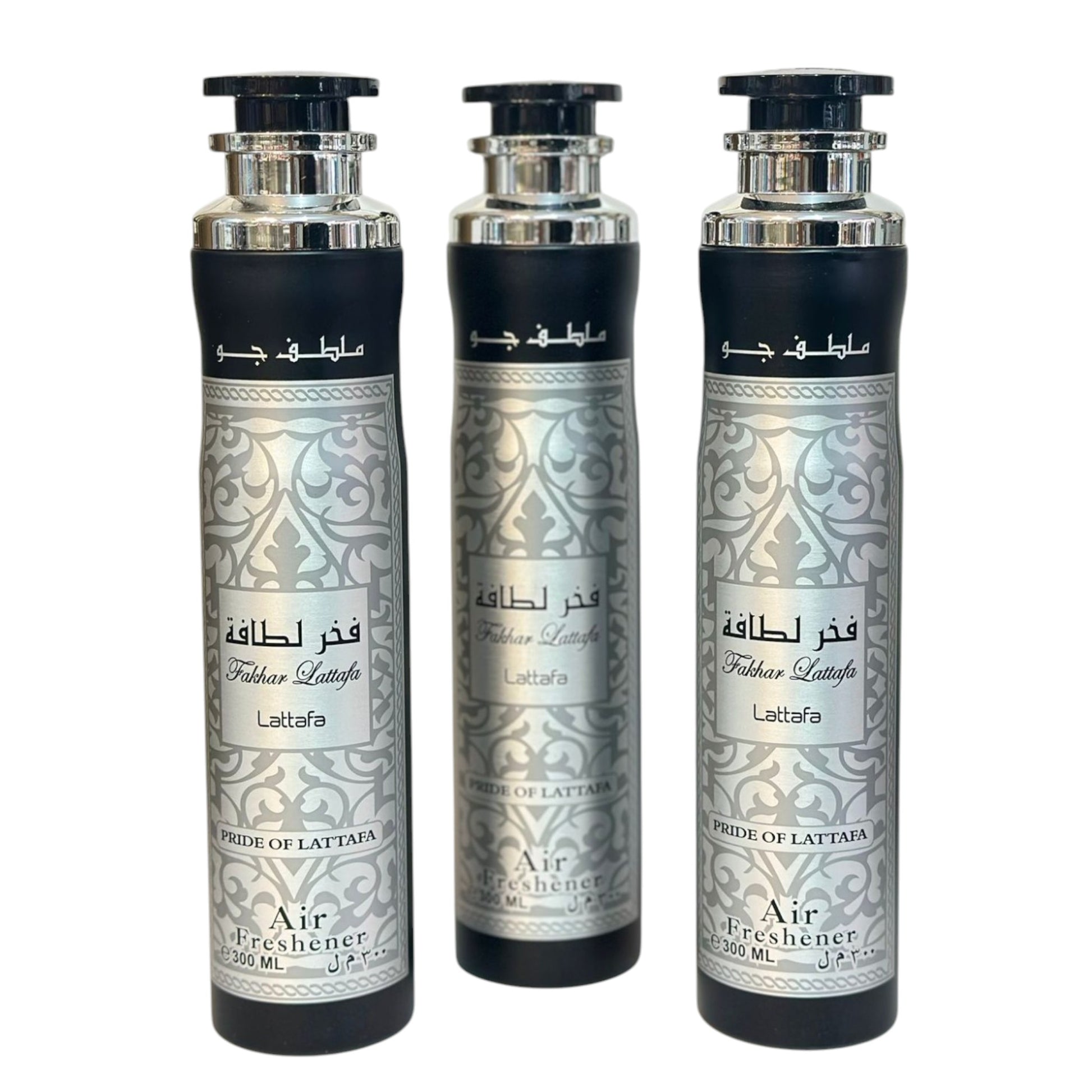 Three bottles of Fakhar air freshener with intricate silver patterns on the labels.