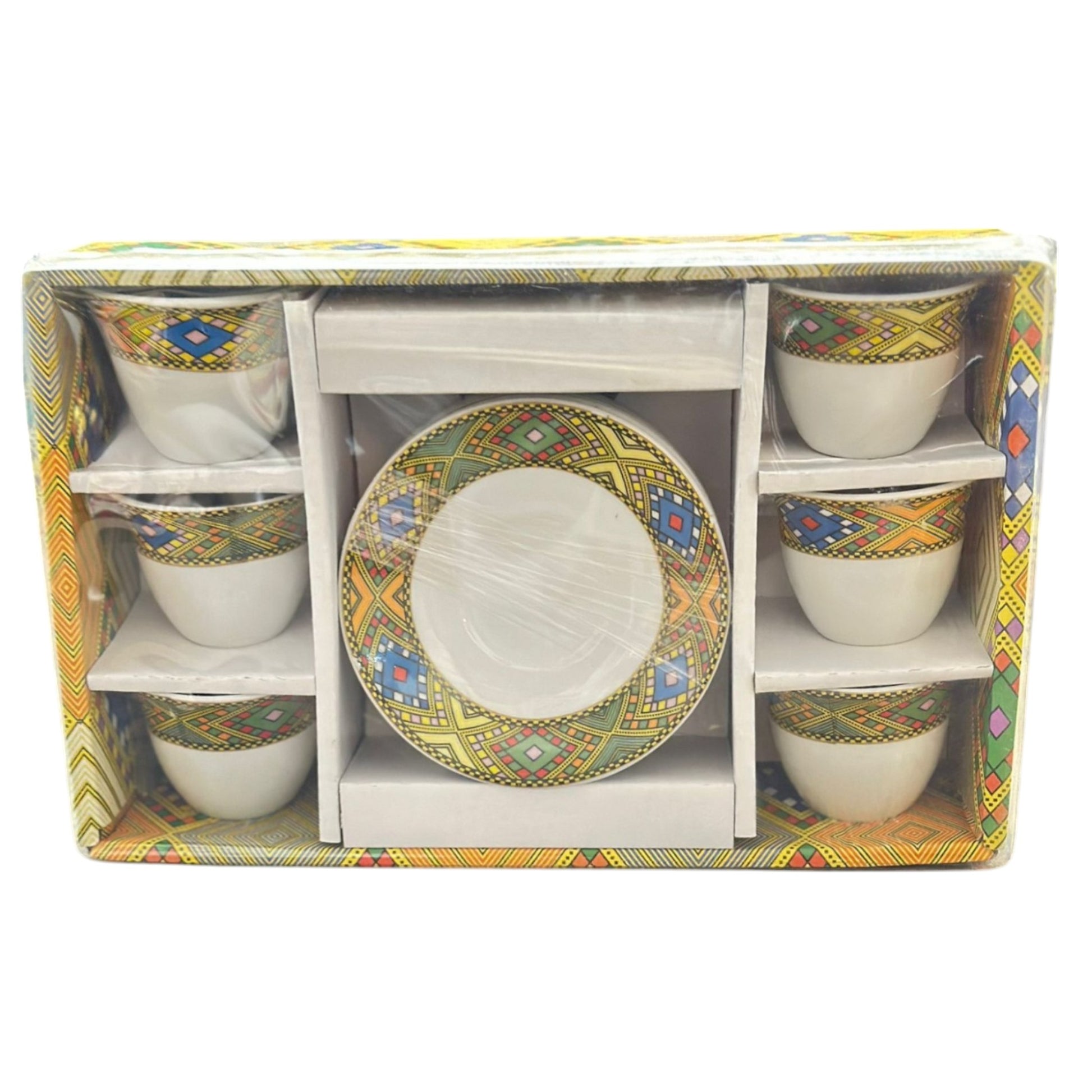 A set of Habesha styled coffee cups and plates with traditional geometric patterns, displayed in packaging.