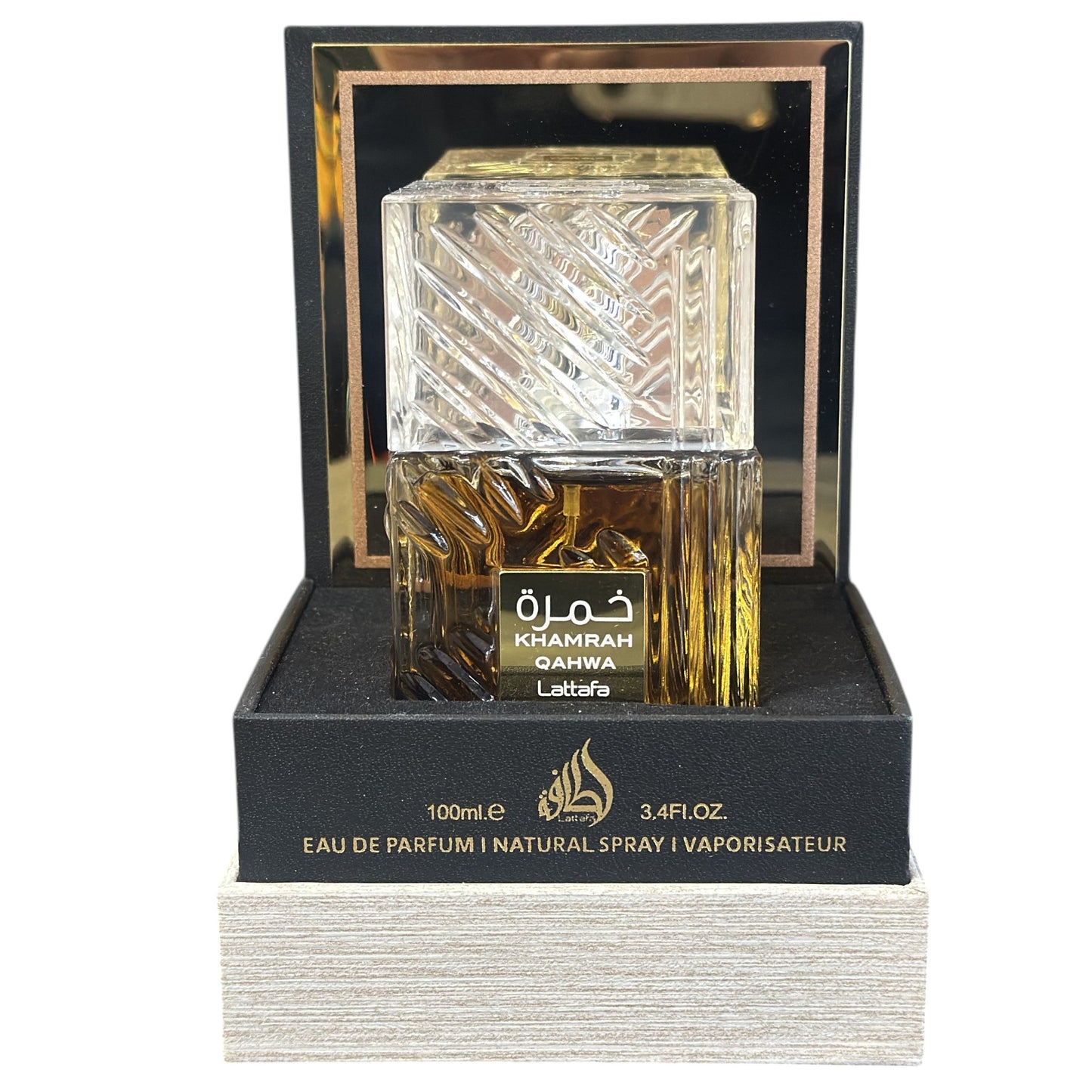 Perfume bottle with intricate design in a black box on a white background