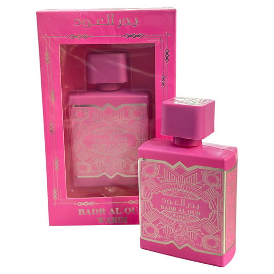 Pink perfume bottle and packaging with 'Badr Al Oud' branding on a white background
