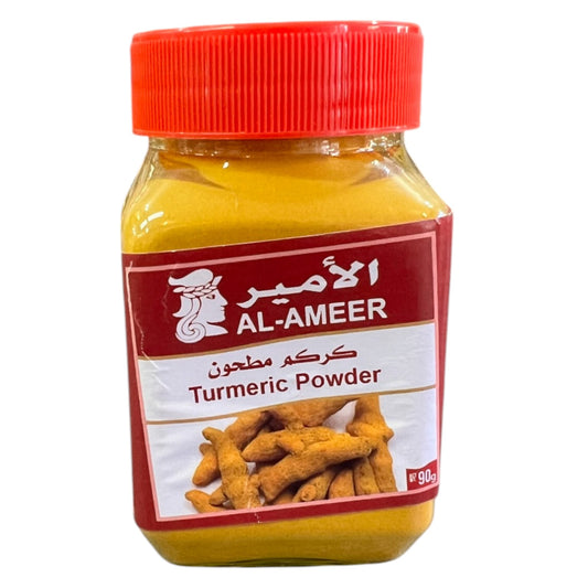 A plastic jar of AL-AMEER Turmeric Powder with a red lid. The label has a picture of turmeric roots and text.