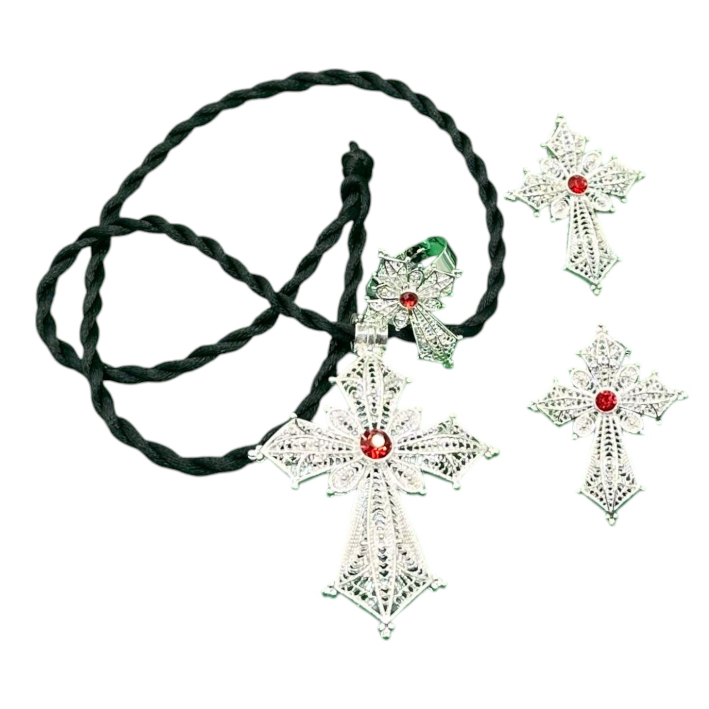 A traditional Habesha women's jewellery set, featuring a silver-plated cross with red accents and a black thread necklace.