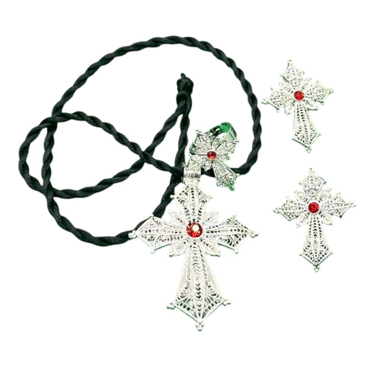A traditional Habesha women's jewellery set, featuring a silver-plated cross with red accents and a black thread necklace.