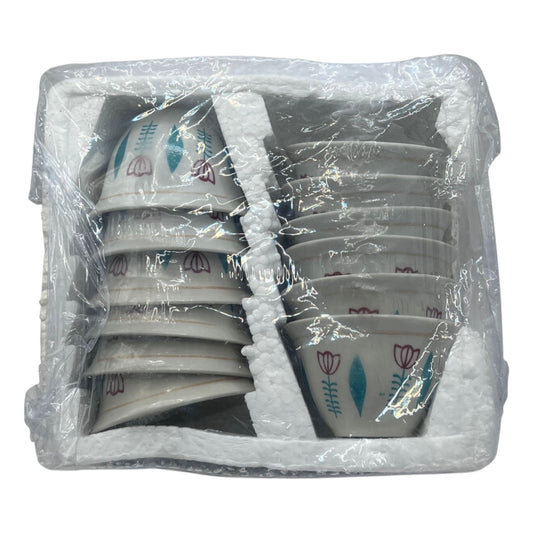 A set of traditional habesha ceramic coffee cups wrapped in plastic, with geometric patterns in blue and white.