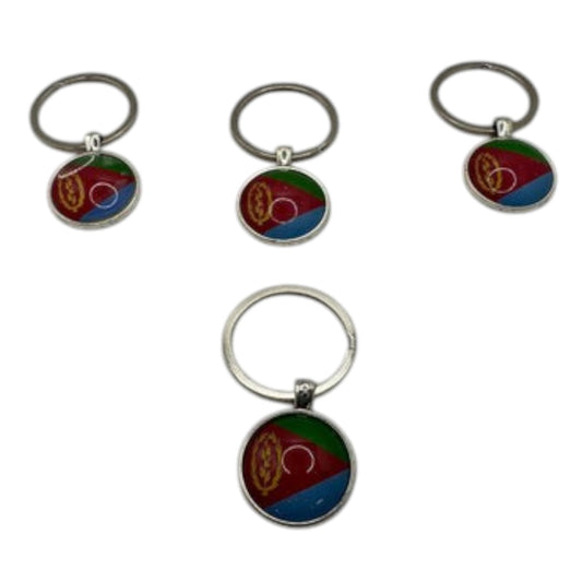 A set of Eritrean flag design key chains, featuring the national colors and emblem on a circular holder.