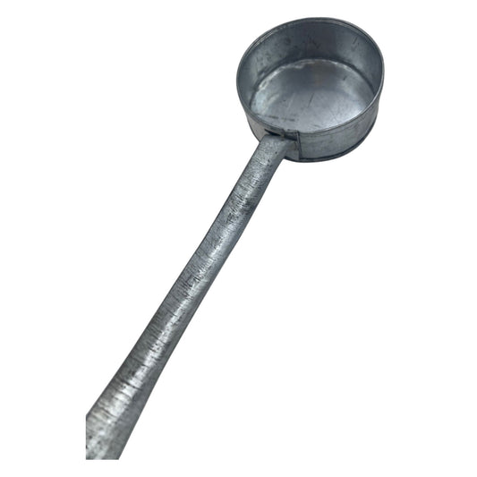 A traditional handmade metal Habesha jebena coffee roaster with a long handle.