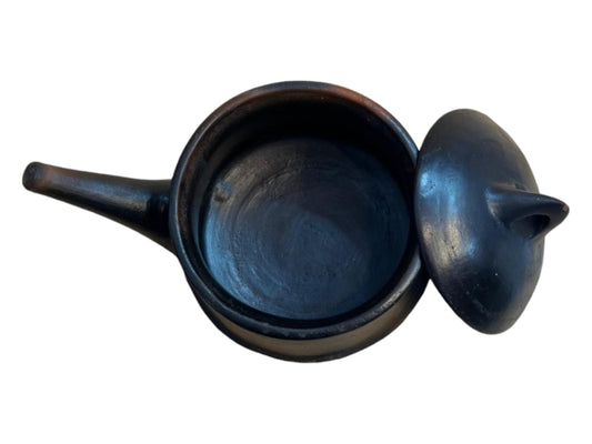 A traditional black Habesha clay pot with a lid, handcrafted for preparing shiro tegabino and other dishes.