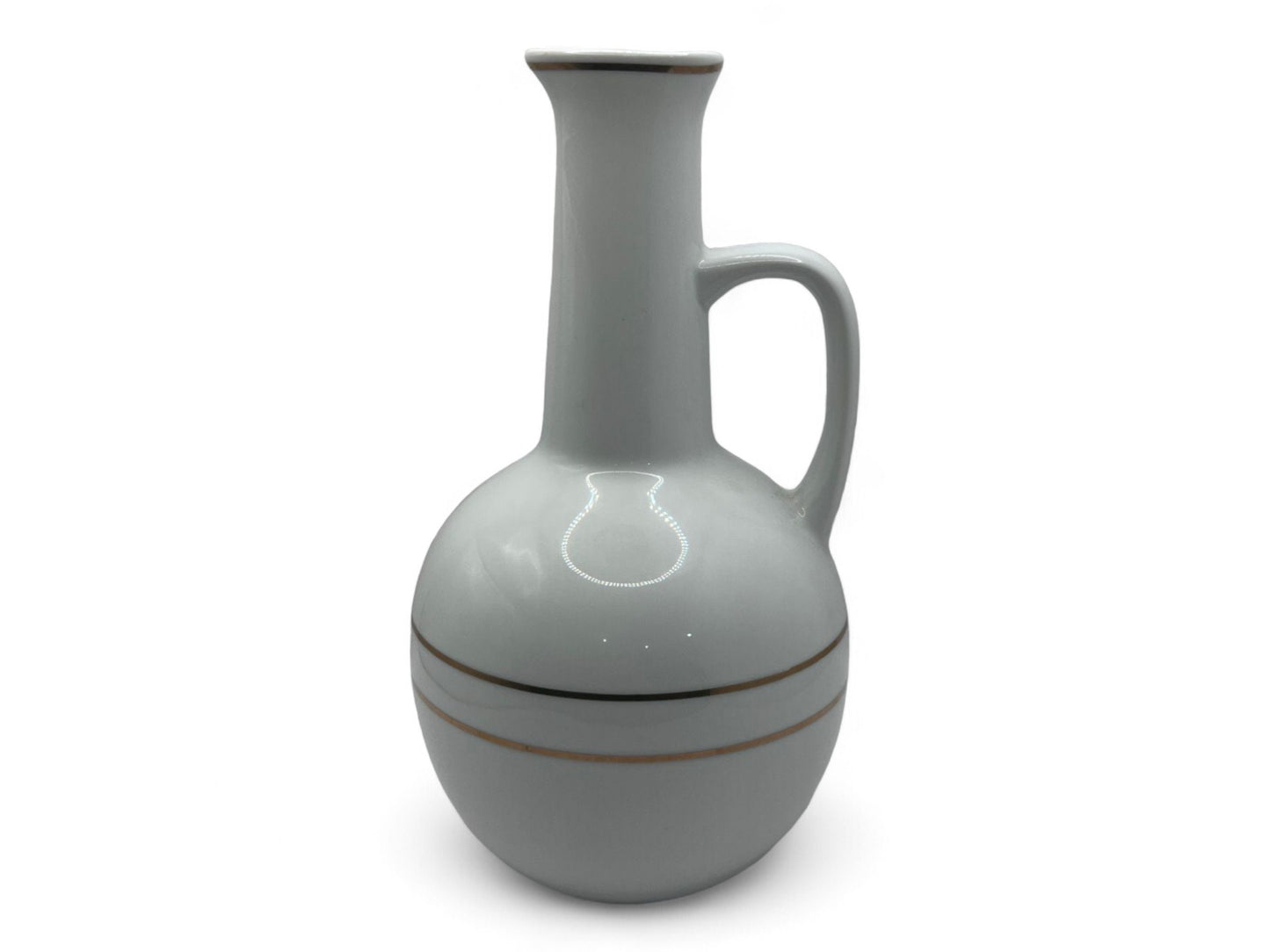 A white ceramic Habesha Jebena coffee pot with zuria design stripes, used for making traditional coffee ceremony.