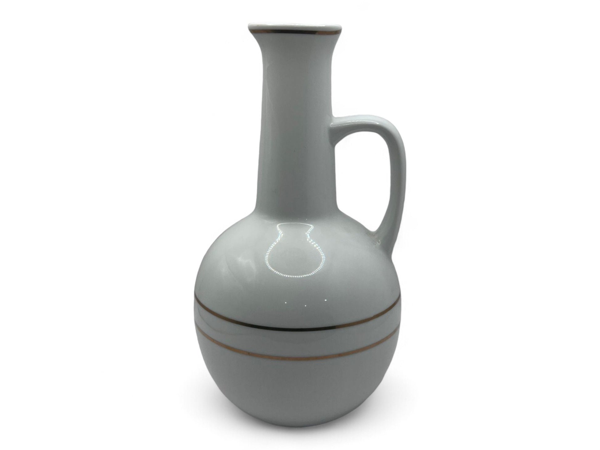 A white ceramic Habesha Jebena coffee pot with zuria design stripes, used for making traditional coffee ceremony.