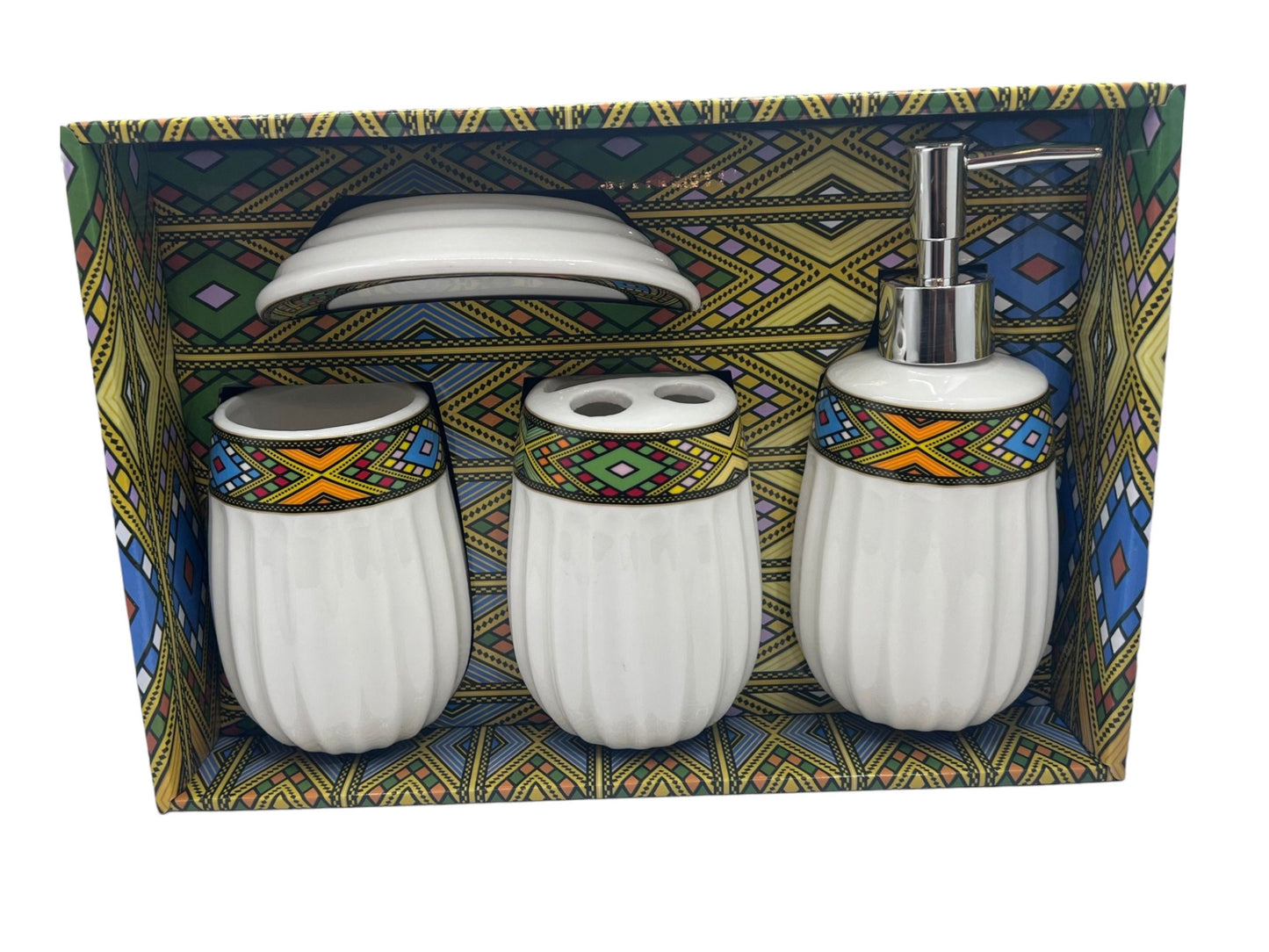 A set of ceramic toilet accessories with a traditional Habesha design, displayed in a box with a colorful geometric pattern.