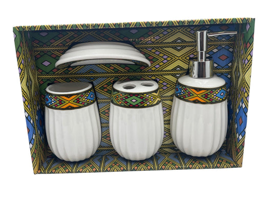 A set of ceramic toilet accessories with a traditional Habesha design, displayed in a box with a colorful geometric pattern.
