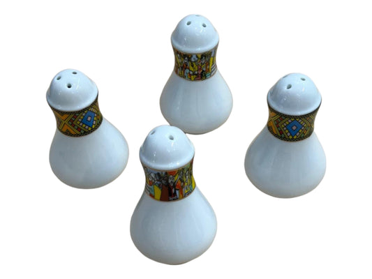 A set of four white salt holders with multicolored floral and geometric patterns on the base.