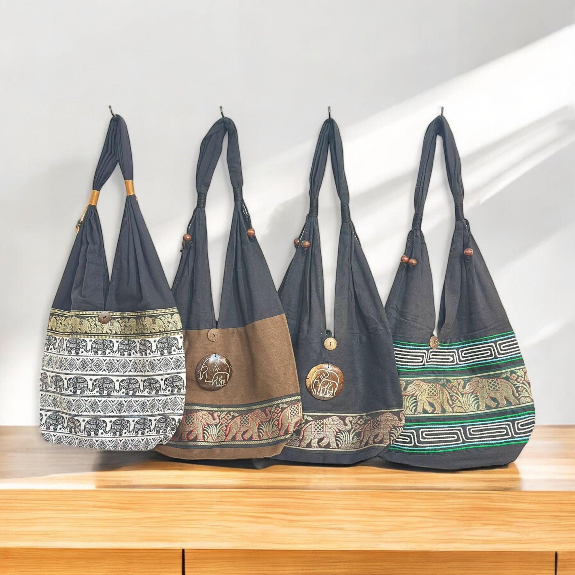 A collection of four African handmade tote bags with traditional woven designs, displayed side by side.
