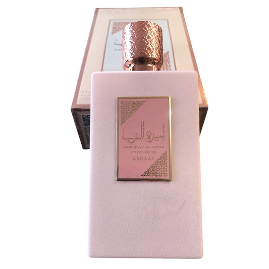 Perfume bottle with pink packaging and gold cap on a white background