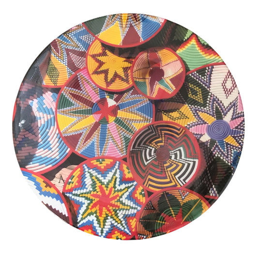 Colorful woven basket pattern on a circular object with a white background