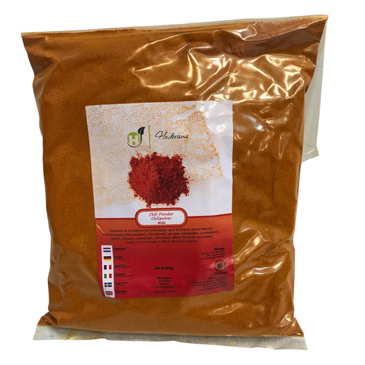 Bag of red chili powder with a label on a white background