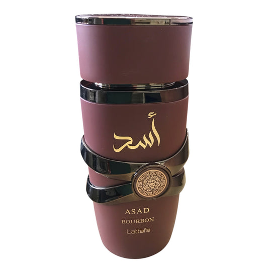 Maroon tumbler with gold text and branding on a white background
